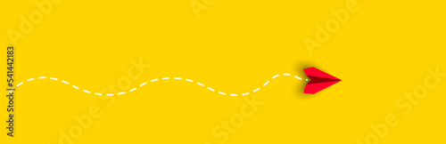Red paper airplane flying on yellow background.Thinking different, Business leader, personality development idea concept.