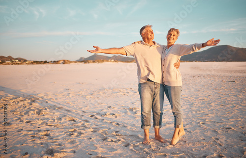 Slika na platnu Love, beach and summer with a senior couple standing together on the sand on a sunny day