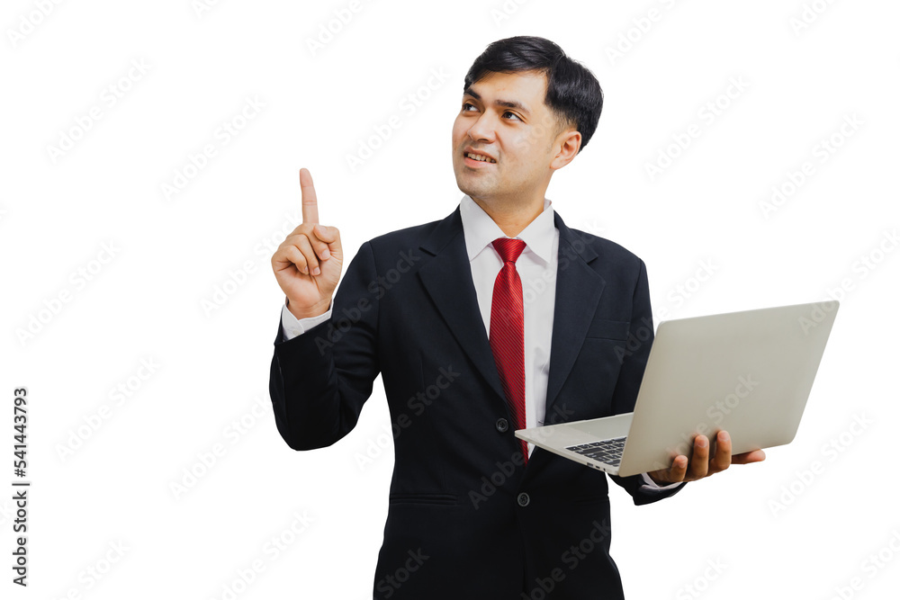 Asian handsome businessman in suit holding laptop and pointing to present Asian handsome businessman in suit holding laptop and pointing to present