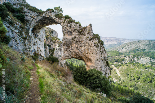 Los Arcs hiking path. a tourist route surrounded by greenery, mountains, valleys, natural rock bridges. Ruta and los Arcos de Castillos