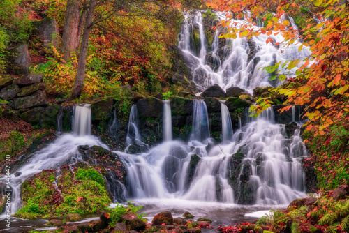 Beautiful waterfall in autumn forest in Jonkoping, Sweden. Long exposure.