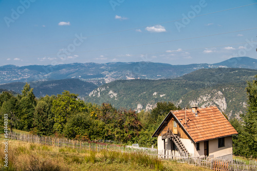 Wooden country side house for family recreation placed on hillside with amazing view on mountains, ecological and recreational place . Amazing landscape from traditional country house in Bosnia
