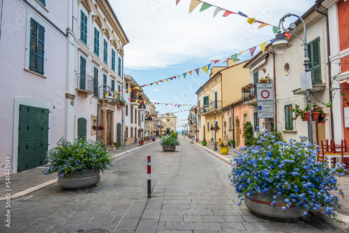 The beautiful main street of San VIto Chietino with colored flowers and facades photo