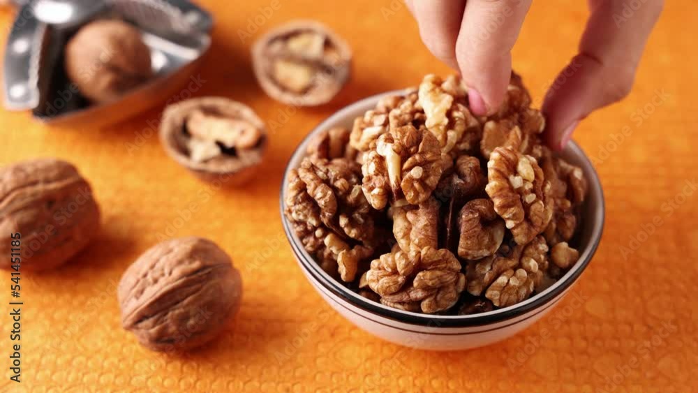 Walnut hard sell cut open. Dry fruits and nuts in Kerala India. Protein fiber rich food snack diet mixed nuts layout seeds, food for muscle body building.