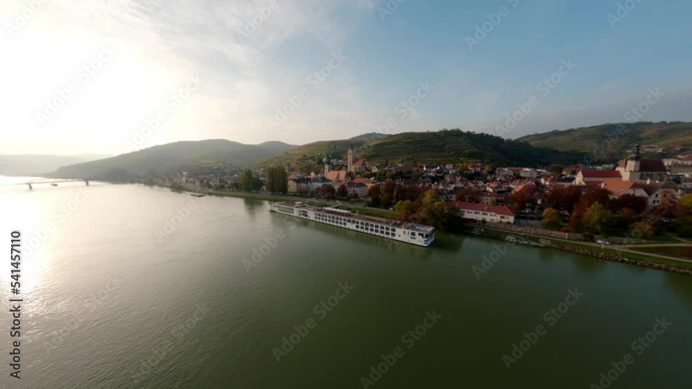 Slow rotating aerial shot of the city Stein an der Donau with beautiful surrounding hills and nature. Slow rotating aerial shot of the city Stein an der Donau with beautiful surrounding hills and nature.