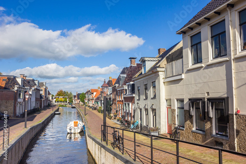 Boats in the canal of the historic village Kollum, Netherlands © venemama