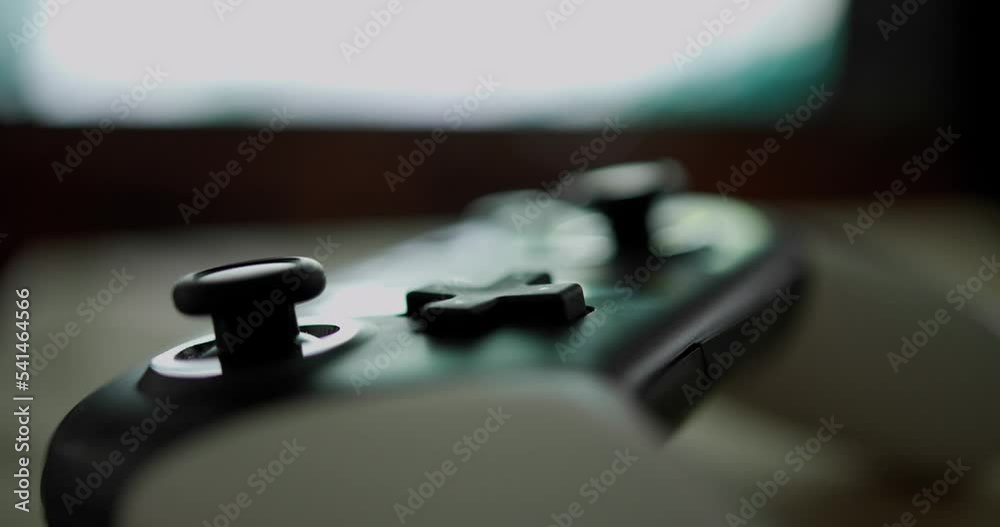Video game joystick over the television at home