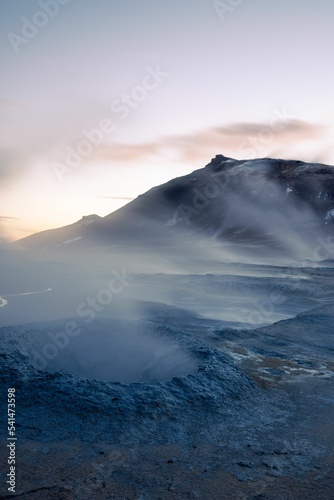 Vertical shot of the Namafjall Hverir covered with fog in Iceland