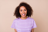 Photo of funny funky lady wear violet t-shirt smiling showing tongue out isolated beige color background