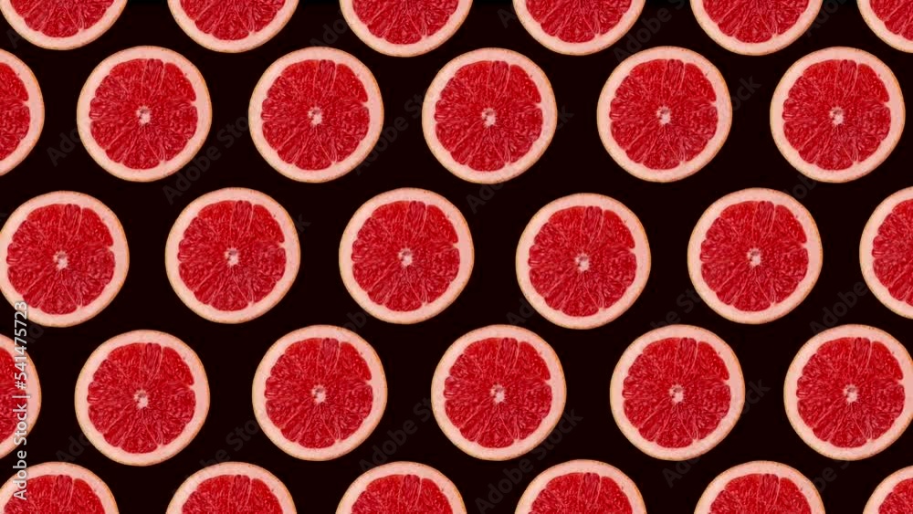 Modern trendy, bright, food animation of rotating limes on a pink background. Looped animation
