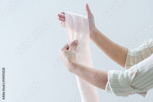 Wallpaper Mural Hands covered with painful care bandages on white background. Woman's hand injured, broken bone, raft care Torontodigital.ca