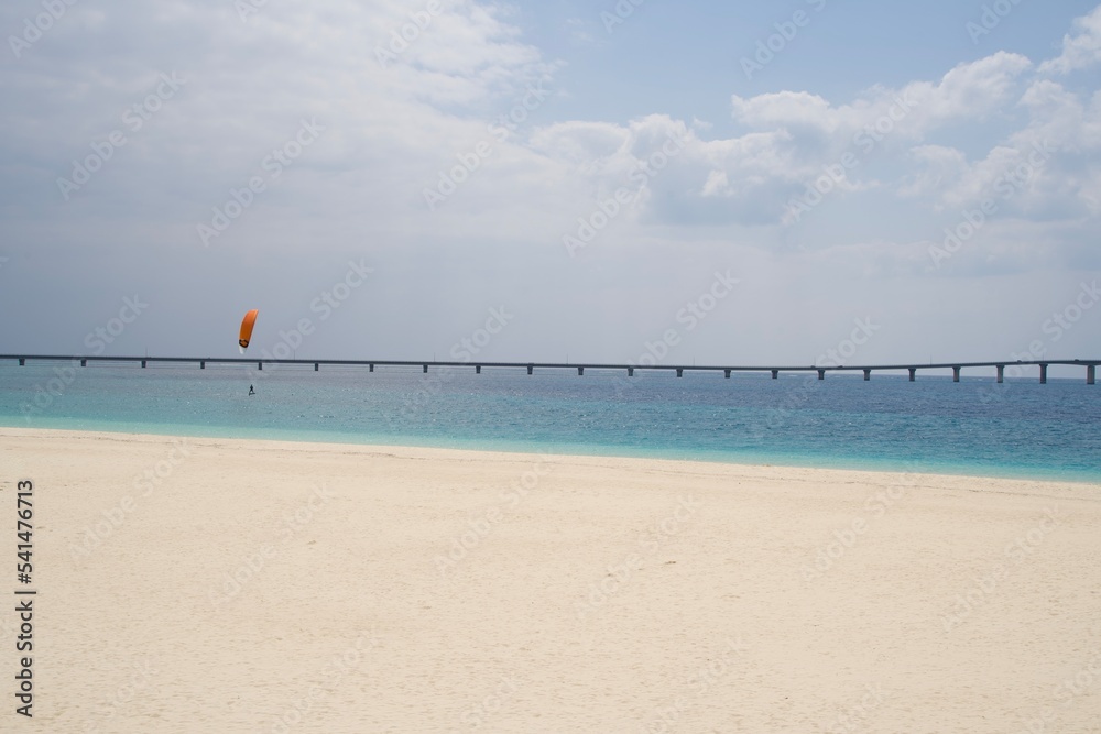 Fototapeta premium Sandy beach and marine activities at Yonaha Beach