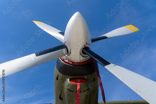 Low angle of aviation propeller of military aircraft transall c160 with blue sky in the background photo