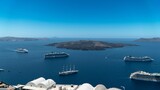 High-angle view of ships and small islands in the Aegean sea on a sunny day in Santorini, Greece