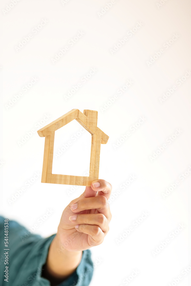 Insurance house, and family health live concept. The insurance agent presents the hands protection model that symbolize the coverage. Insurance house, and family health live concept. The insurance agent presents the hands protection model that symbolize the coverage.