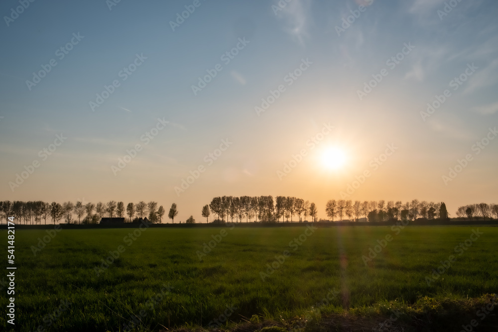 Magnificent, very colorful sunrise. Magic dawn over the Dutch polders. Nature in the Netherlands. A colorful winter. High quality photo Magnificent, very colorful sunrise. Magic dawn over the Dutch polders. Nature in the Netherlands. A colorful winter. High quality photo