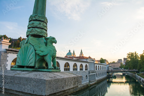 One of the smaller dragon statues on Dragon Bridge, or Zmajski Most, a reinforced concrete bridge which crosses the Ljubljanica River in central Ljubljana, Slovenia. It was built in Vienna Secession s photo