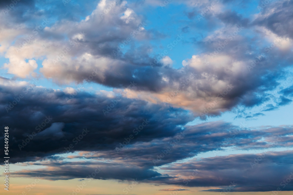 Dark cloudy sky at sunset, natural background texture