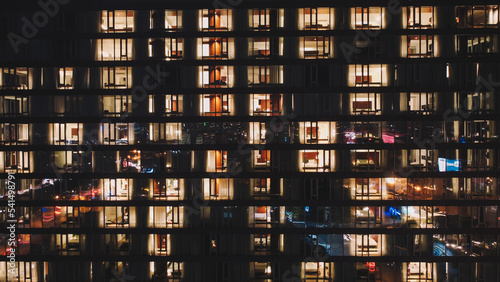 Night office windows view. Lights inside the night office windows