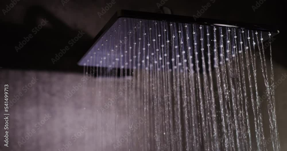 Jets of water pour from a modern diffuser shower system