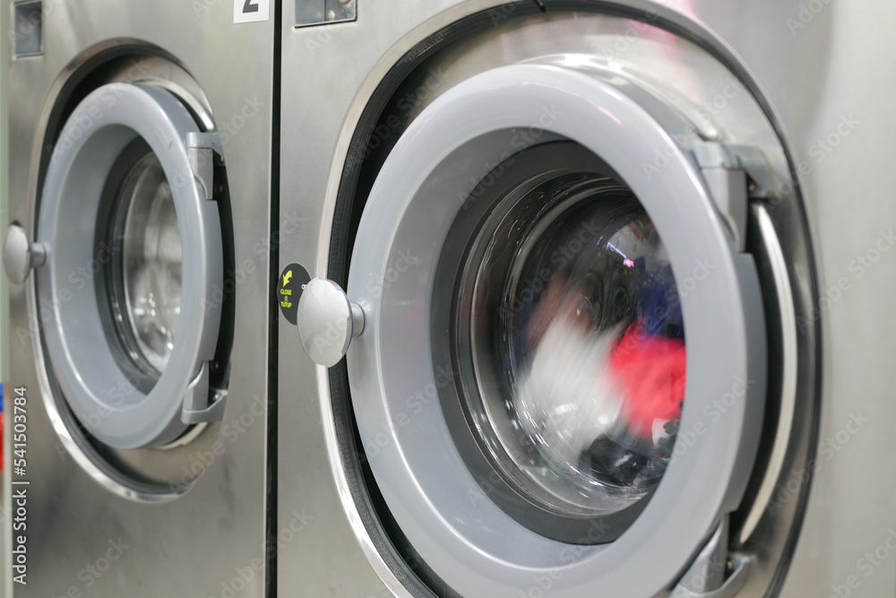 close up of cloths in a washing machine. close up of cloths in a washing machine.