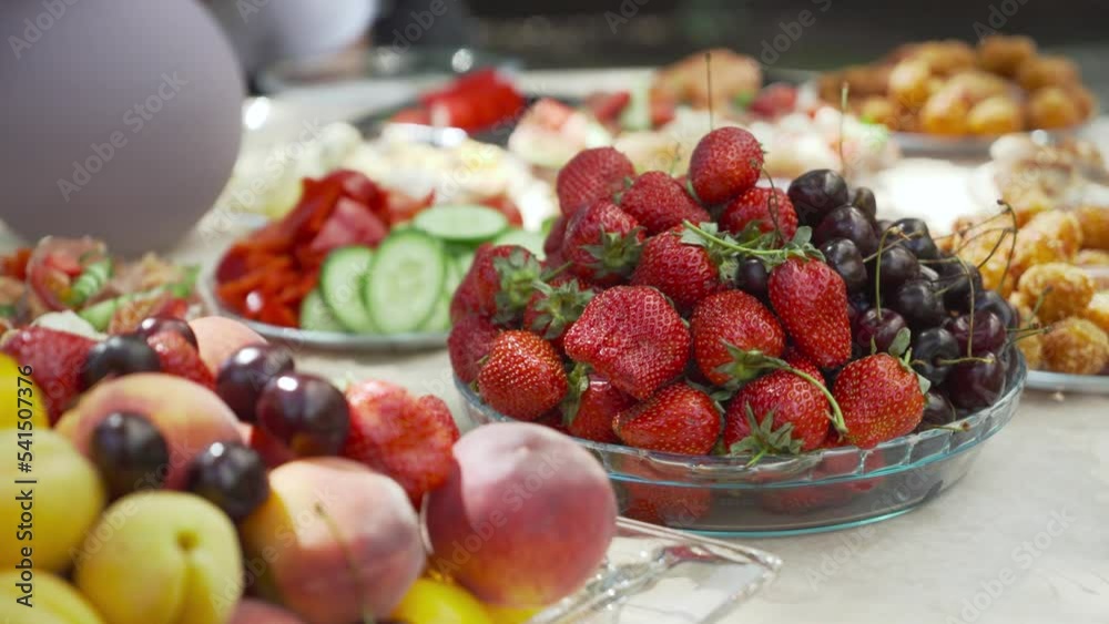 Strawberries and cherries and other fruits on a plate at a holiday. Strawberries and cherries and other fruits on a plate at a holiday.