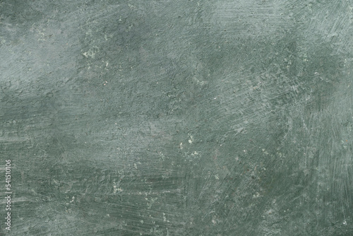 Texture of dark vintage green stone background, Wide banner. Abstract grunge decorative stucco wall texture. Wide rough background with copy space for text