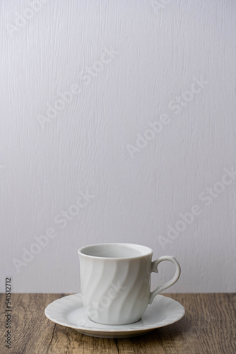 white coffee mug on wooden table