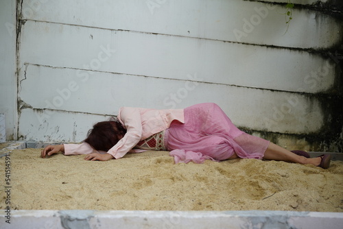 Dead woman lay down under bag covered death body from accident or murder at house of victim with evidence. Horror scene for Halloween.