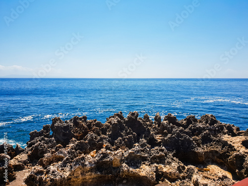 Clean sea water and rocky beach