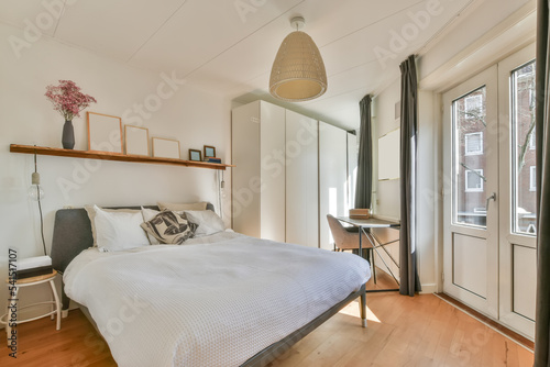Sunlit bedroom with balcony door