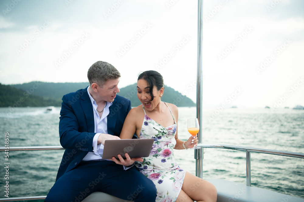 On a yacht, a businessman begins his family's vacation. a huge project agreement was successfully closed, On a yacht, a businessman begins his family's vacation. a huge project agreement was successfully closed,