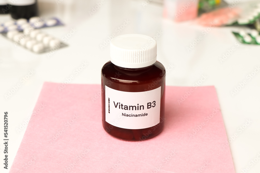 Vitamin B3 pills in a bottle, food supplement or used to treat disease