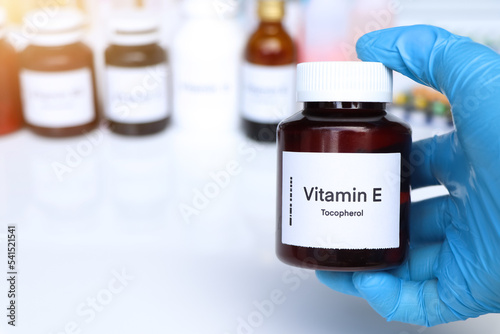 Vitamin E pills in a bottle, food supplement or used to treat disease