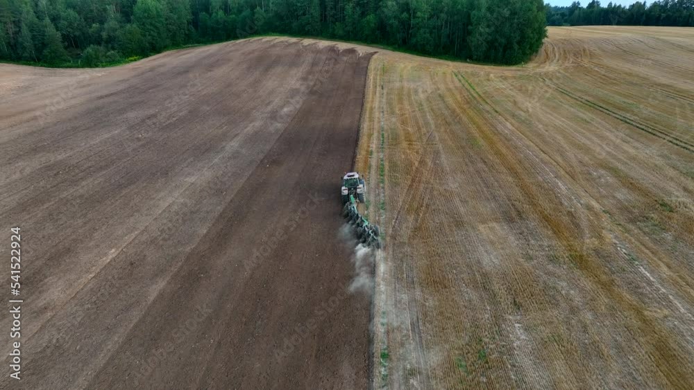 Vidéo Stock Tractor on Soil cultivation at field. Disk harrow on