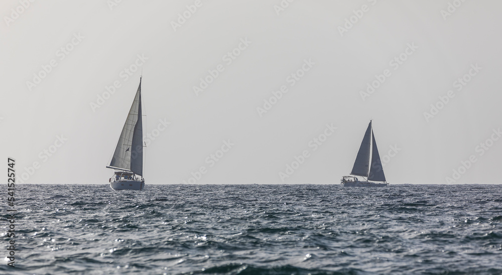 Sailboat on the horizon of the Mediterranean Sea