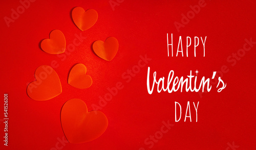 Red hearts on a red background