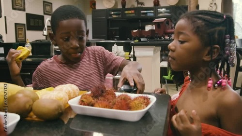 Young Black children, Black girls, Black boy, Black infant baby, Black parents, Black mother, and Black father cooking and eating lunch and dinner at home