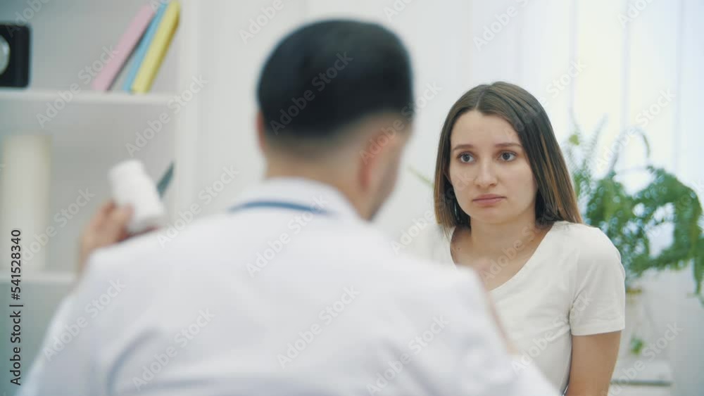 4k slow motion video of pregnant woman speaking with a doctor. 4k slow motion video of pregnant woman speaking with a doctor.