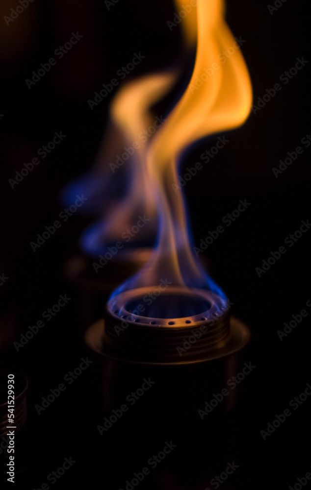 Energy crisis, alcohol burners burn flames in the dark in the kitchen, heating the house, heating food on fire Energy crisis, alcohol burners burn flames in the dark in the kitchen, heating the house, heating food on fire