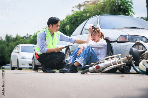 Accident, crash or collision of auto car, bicycle at outdoor. Include people i.e. insurance officer man and young girl or bicycle rider to injury on road. Concept for vehicle crash, insurance claim.  © DifferR