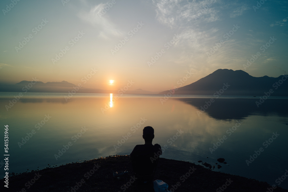 silhouette of a person on a sunset silhouette of a person on a sunset