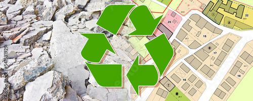 Recovery and recycling of concrete and brick rubble debris on construction site after a demolition of building - concept with a city map and buildings photo