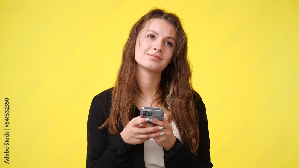 4k video of cute woman using phone isolated over pink background. 4k video of cute woman using phone isolated over pink background.