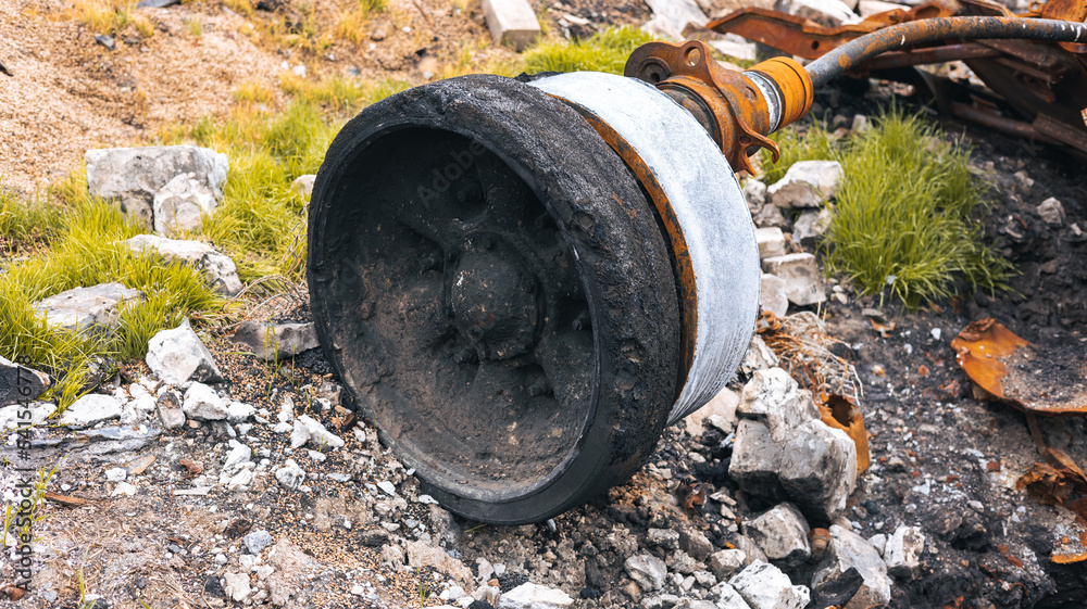 War in Ukraine, a destroyed tank, detonation of ammunition, a tank roller torn off with a shaft close-up, Kharkiv region War in Ukraine, a destroyed tank, detonation of ammunition, a tank roller torn off with a shaft close-up, Kharkiv region