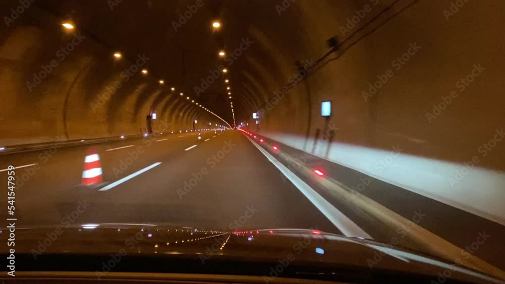 car drive in a tunnel with lights.