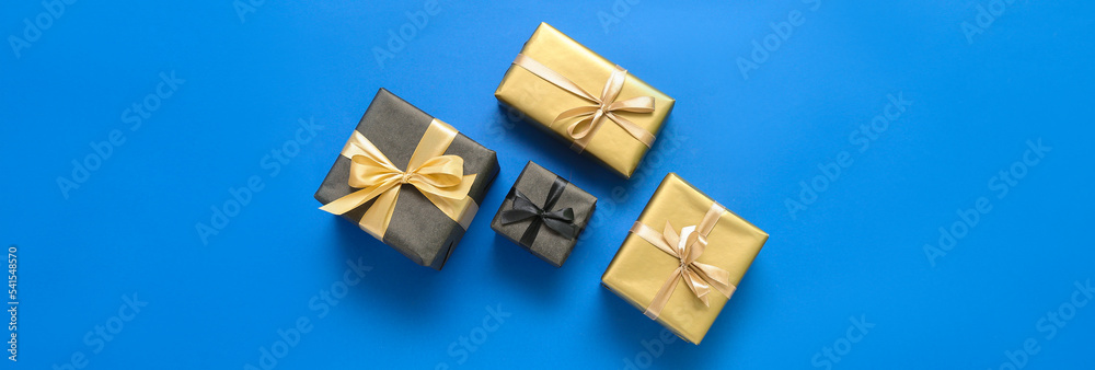 Gift boxes on blue background, top view