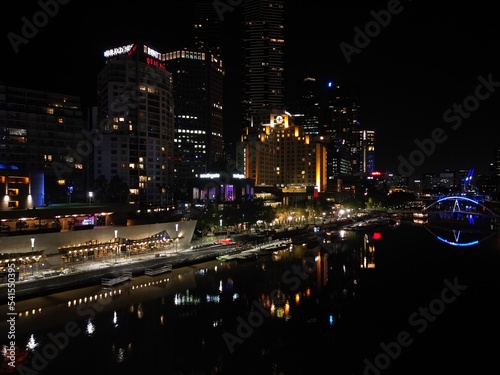 aerial view of Melbourne city skyline at night High rise apartments and office space lit up in the dark displaying the City skyline