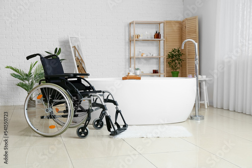 Modern empty wheelchair in ...
