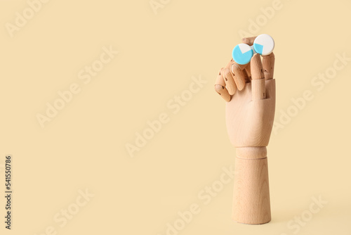 Wooden hand with contact le...